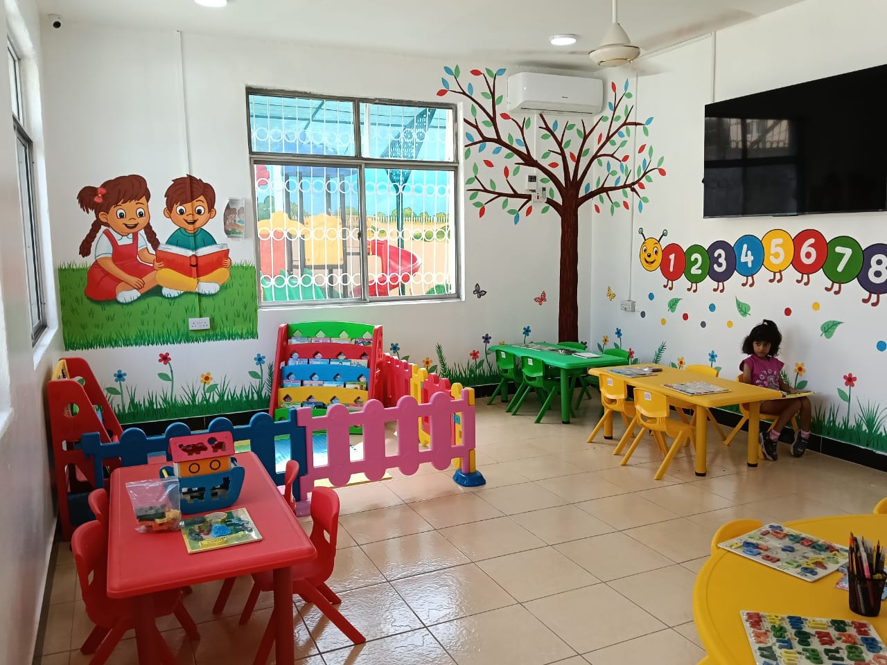 Classroom with numbers wall and study tables