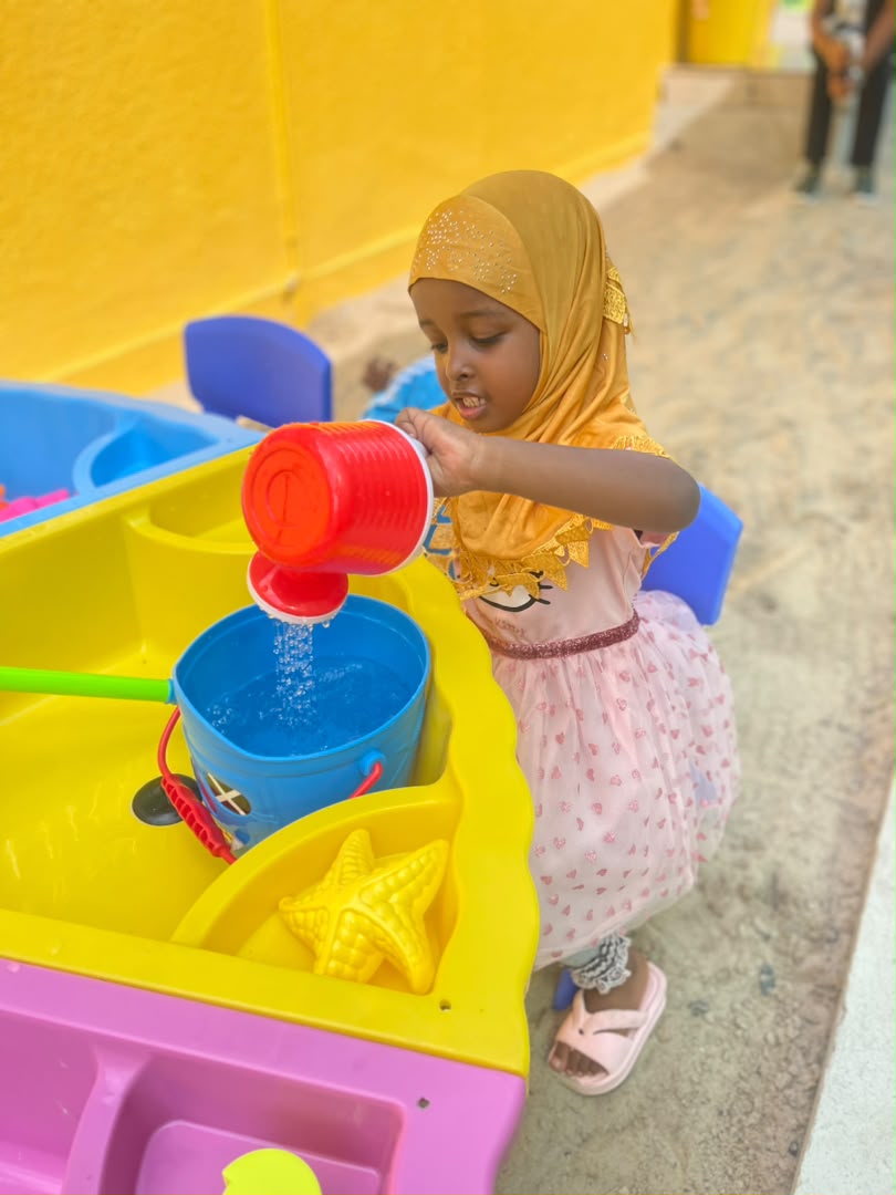 A little one enjoying water play